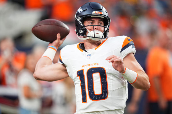 Aug 18, 2024; Denver, Colorado, USA; Denver Broncos quarterback Bo Nix warms up in the first quarter against the Green Bay Packers at Empower Field at Mile High. Mandatory Credit: Ron Chenoy-USA TODAY Sports