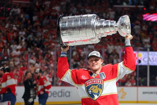 Jun 17, 2025; Sunrise, Florida, USA; Florida Panthers center Anton Lundell (15) hoists the Stanley Cup after winning game six of the 2025 Stanley Cup Final against the Edmonton Oilers at Amerant Bank Arena. Mandatory Credit: Sam Navarro-Imagn Images