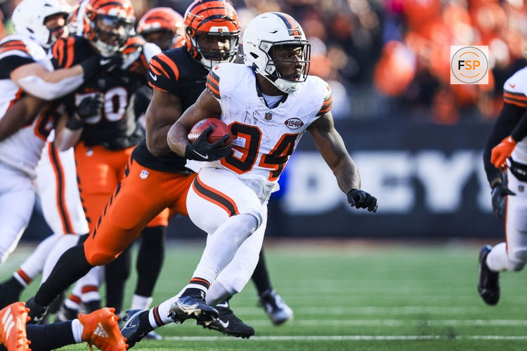 Dec 22, 2024; Cincinnati, Ohio, USA; Cleveland Browns running back Jerome Ford (34) runs with the ball against the Cincinnati Bengals in the first half at Paycor Stadium. Credit: Katie Stratman-Imagn Images