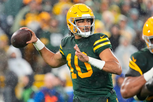 Nov 10, 2024; Landover, Maryland, USA; Washington Commanders quarterback Jayden Daniels (5) carries the ball as Pittsburgh Steelers linebacker Patrick Queen (6) defends during the first half at Northwest Stadium. Mandatory Credit: Amber Searls-Imagn Images