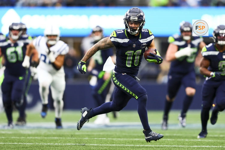 Dec 14, 2025; Seattle, Washington, USA; Seattle Seahawks wide receiver Jaxon Smith-Njigba (11) runs for yards after the catch against the Indianapolis Colts during the third quarter at Lumen Field. Credit: Kevin Ng-Imagn Images