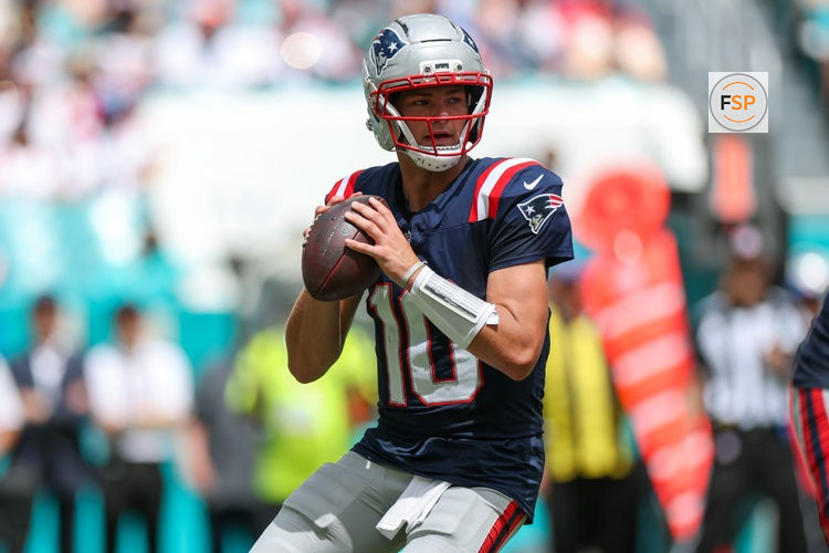 Sep 14, 2025; Miami Gardens, Florida, USA; New England Patriots quarterback Drake Maye (10) looks to pass against the Miami Dolphins in the second quarter at Hard Rock Stadium. Credit: Nathan Ray Seebeck-Imagn Images