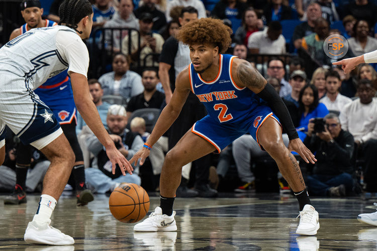 Dec 15, 2024; Orlando, Florida, USA; New York Knicks guard Miles McBride (2) defends Orlando Magic guard Anthony Black (0) in the second quarter at Kia Center. Credit: Jeremy Reper-Imagn Images