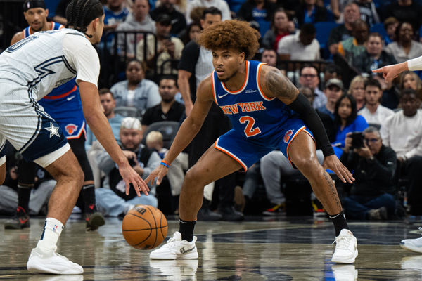 Dec 15, 2024; Orlando, Florida, USA; New York Knicks guard Miles McBride (2) defends Orlando Magic guard Anthony Black (0) in the second quarter at Kia Center. Mandatory Credit: Jeremy Reper-Imagn Images