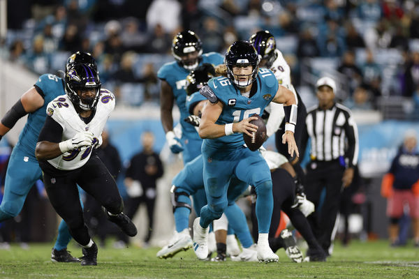 JACKSONVILLE, FL - DECEMBER 17: Jacksonville Jaguars quarterback Trevor Lawrence (16) runs with the ball during the game between the Jacksonville Jaguars and the Baltimore Ravens on December 17, 2023 at EverBank Stadium in Jacksonville, Fl. (Photo by David Rosenblum/Icon Sportswire)