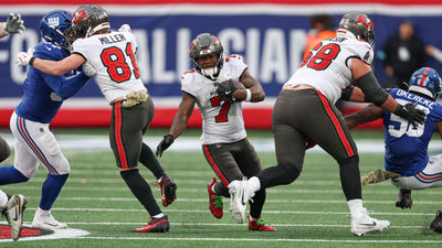 Nov 24, 2024; East Rutherford, New Jersey, USA; Tampa Bay Buccaneers running back Bucky Irving (7) carries the ball during the second half against the New York Giants at MetLife Stadium. Mandatory Credit: Vincent Carchietta-Imagn Images