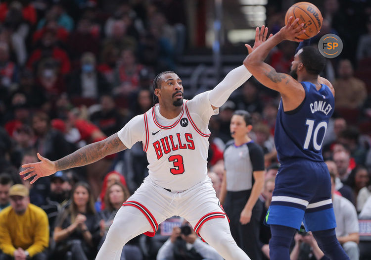 CHICAGO, IL - FEBRUARY 06: Andre Drummond #3 of the Chicago Bulls guards Mike Conley #10 of the Minnesota Timberwolves during the first half at the United Center on February 6, 2024 in Chicago, Illinois. (Photo by Melissa Tamez/Icon Sportswire)