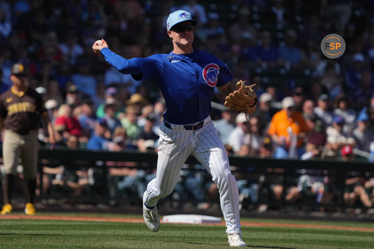 Mar 4, 2025; Mesa, Arizona, USA; Chicago Cubs third baseman Matt Shaw makes the off balance throw for an out against the San Diego Padres in the third inning at Sloan Park. Credit: Rick Scuteri-Imagn Images