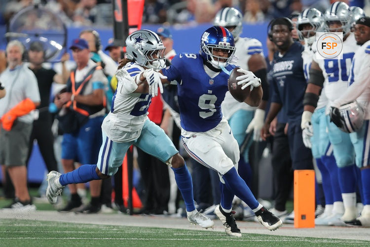 Sep 13, 2026; East Rutherford, New Jersey, USA;  New York Giants tight end Isaiah Likely (9) carries the ball defended by Dallas Cowboys cornerback Shavon Revel Jr. (28) during the second quarter at MetLife Stadium.  Credit: Brad Penner-Imagn Images