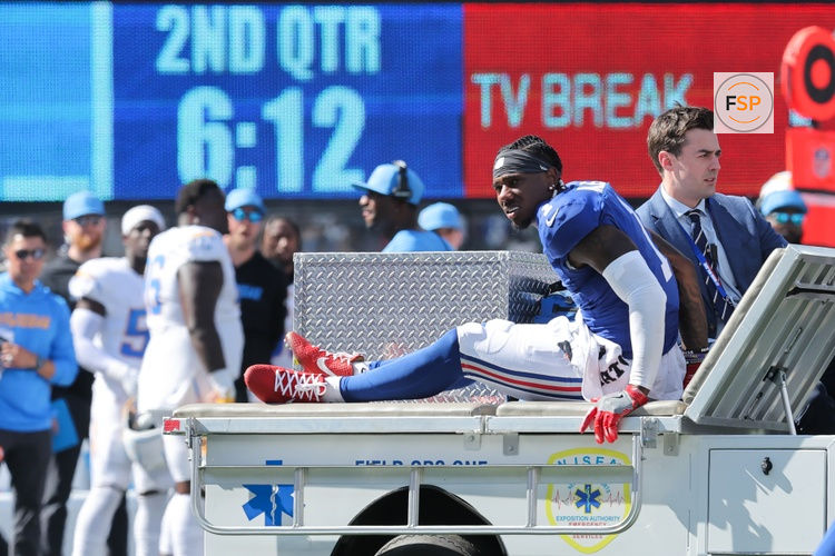 Sep 28, 2025; East Rutherford, New Jersey, USA; New York Giants wide receiver Malik Nabers (1) is carted off the field following an injury during the second quarter against the Los Angeles Chargers at MetLife Stadium. Credit: Brad Penner-Imagn Images