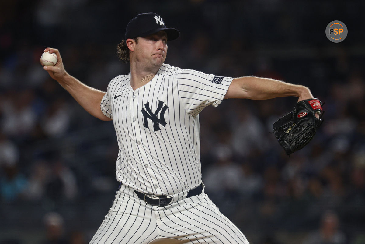 Sep 26, 2024; Bronx, New York, USA; New York Yankees starting pitcher Gerrit Cole (45) delivers a pitch during the first inning against the Baltimore Orioles at Yankee Stadium. Credit: Vincent Carchietta-Imagn Images