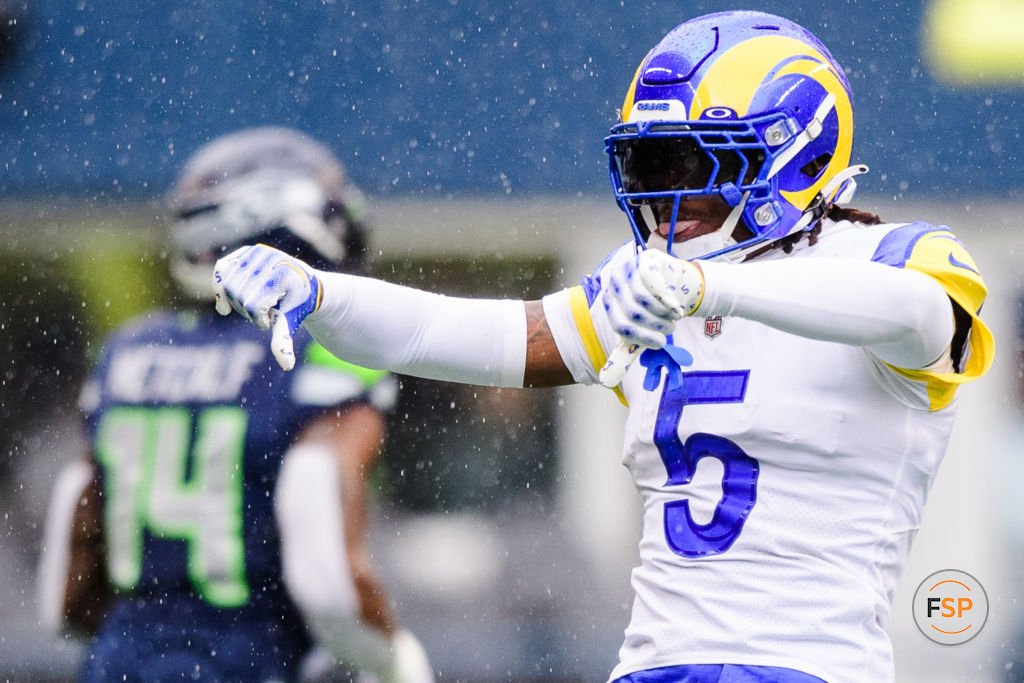 SEATTLE, WASHINGTON - JANUARY 08: Jalen Ramsey #5 of the Los Angeles Rams gestures towards the Seattle Sehaawks bench during the first half of the game at Lumen Field on January 08, 2023 in Seattle, Washington. (Photo by Jane Gershovich/Getty Images)