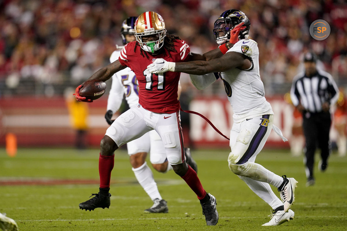 Dec 25, 2023; Santa Clara, California, USA; San Francisco 49ers wide receiver Brandon Aiyuk (11) runs with the ball next to Baltimore Ravens linebacker Patrick Queen (6) in the fourth quarter at Levi's Stadium. Credit: Cary Edmondson-USA TODAY Sports