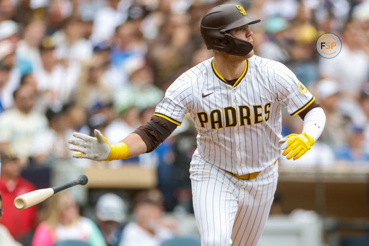 Jun 11, 2025; San Diego, California, USA; San Diego Padres left fielder Gavin Sheets (30) hits a sacrifice fly during the sixth inning against the Los Angeles Dodgers at Petco Park. Credit: David Frerker-Imagn Images