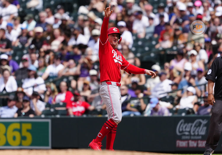 Apr 27, 2025; Denver, Colorado, USA; Cincinnati Reds outfielder Austin Hays (12) reacts following a RBI single in the fifth inning against the Colorado Rockies at Coors Field. Credit: Ron Chenoy-Imagn Images