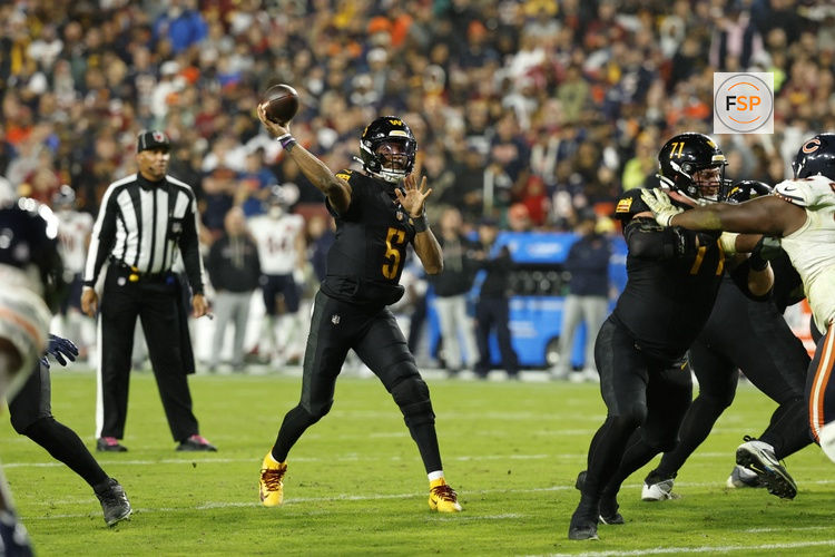 Oct 13, 2025; Landover, Maryland, USA; Washington Commanders quarterback Jayden Daniels (5) passes the ball Washington Commanders quarterback Jayden Daniels (5) during the second half at Northwest Stadium. Credit: Geoff Burke-Imagn Images
