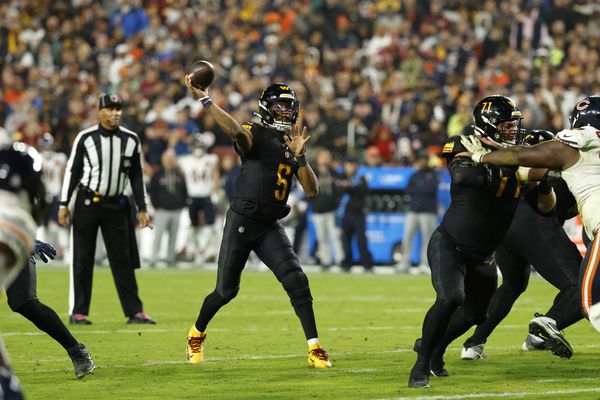 Oct 13, 2025; Landover, Maryland, USA; Washington Commanders quarterback Jayden Daniels (5) passes the ball Washington Commanders quarterback Jayden Daniels (5) during the second half at Northwest Stadium. Mandatory Credit: Geoff Burke-Imagn Images