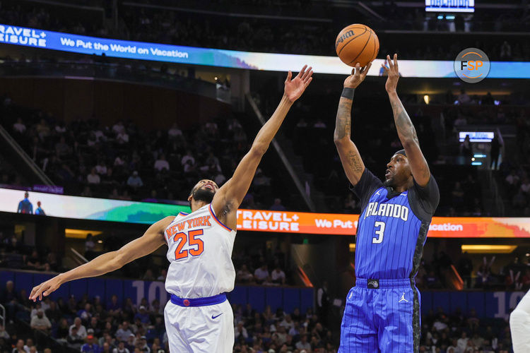 Dec 27, 2024; Orlando, Florida, USA; Orlando Magic guard Kentavious Caldwell-Pope (3) shoots the ball over New York Knicks forward Mikal Bridges (25) during the second half at Kia Center. Credit: Mike Watters-Imagn Images