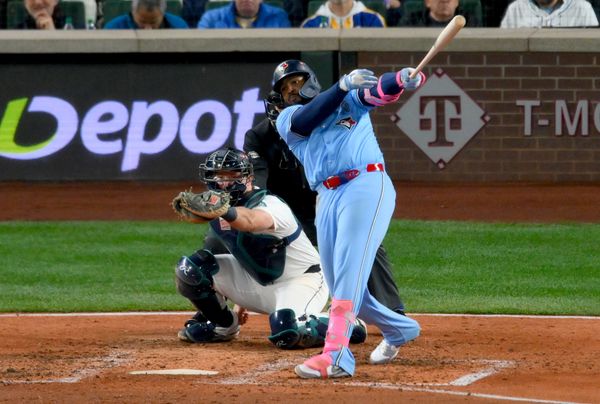 Oct 16, 2025; Seattle, Washington, USA; Toronto Blue Jays first baseman Vladimir Guerrero Jr. (27) hits a home run in the seventh inning against the Seattle Mariners during game four of the ALCS round for the 2025 MLB playoffs at T-Mobile Park. Mandatory Credit: Steven Bisig-Imagn Images