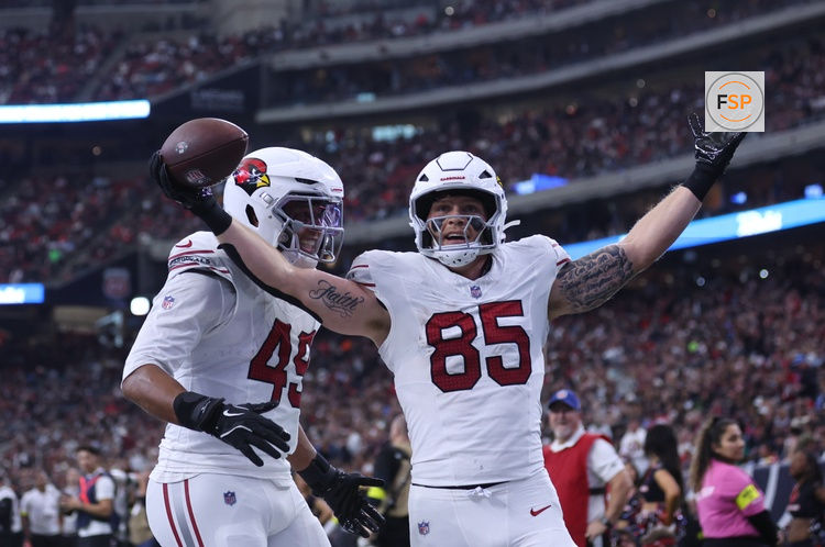 Dec 14, 2025; Houston, Texas, USA; Arizona Cardinals tight end Trey McBride (85) and tight end Pharaoh Brown (49) celebrate a touchdown during the second quarter against the Houston Texans at NRG Stadium. Credit: Troy Taormina-Imagn Images