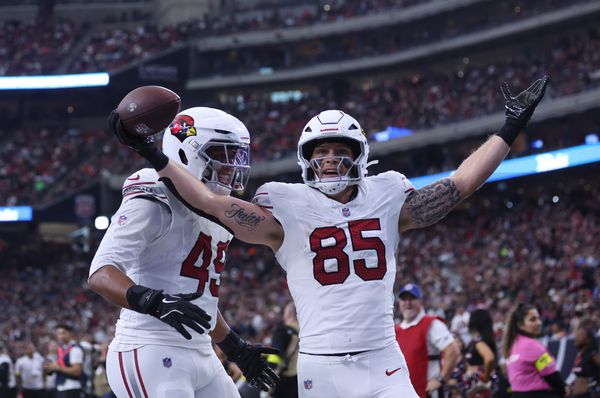 Dec 14, 2025; Houston, Texas, USA; Arizona Cardinals tight end Trey McBride (85) and tight end Pharaoh Brown (49) celebrate a touchdown during the second quarter against the Houston Texans at NRG Stadium. Mandatory Credit: Troy Taormina-Imagn Images