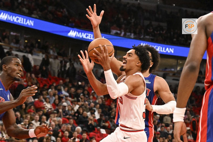 Oct 22, 2025; Chicago, Illinois, USA;  Chicago Bulls guard Tre Jones (30) shoots against Detroit Pistons guard Cade Cunningham (2) during the first half at United Center. Credit: Matt Marton-Imagn Images