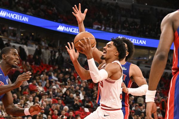 Oct 22, 2025; Chicago, Illinois, USA;  Chicago Bulls guard Tre Jones (30) shoots against Detroit Pistons guard Cade Cunningham (2) during the first half at United Center. Mandatory Credit: Matt Marton-Imagn Images