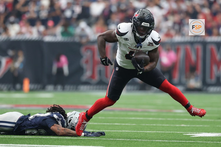 Oct 4, 2026; Houston, Texas, USA;  Houston Texans running back Woody Marks (4) carries the ball against the Houston Texans during the second half at Reliant Stadium.  Credit: Troy Taormina-Imagn Images