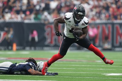 Oct 4, 2026; Houston, Texas, USA;  Houston Texans running back Woody Marks (4) carries the ball against the Houston Texans during the second half at Reliant Stadium.  Mandatory Credit: Troy Taormina-Imagn Images