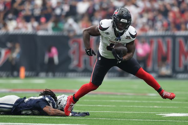 Oct 4, 2026; Houston, Texas, USA;  Houston Texans running back Woody Marks (4) carries the ball against the Houston Texans during the second half at Reliant Stadium.  Mandatory Credit: Troy Taormina-Imagn Images