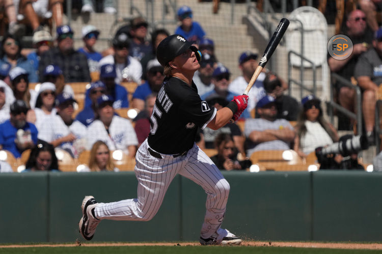 Mar 8, 2025; Phoenix, Arizona, USA; Chicago White Sox Chase Meidroth hits against the Los Angeles Dodgers in the first inning at Camelback Ranch-Glendale. Credit: Rick Scuteri-Imagn Images