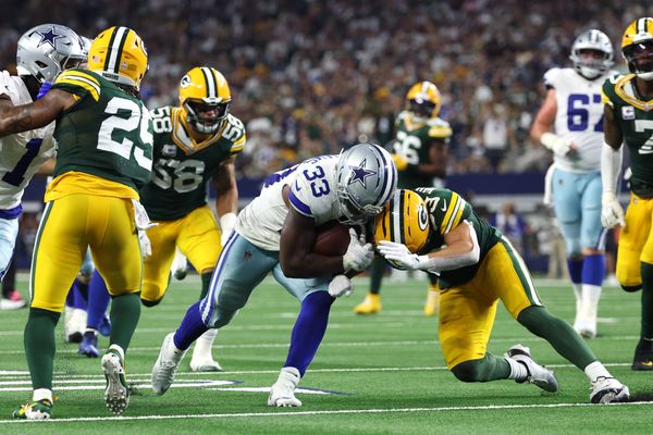 Sep 28, 2025; Arlington, Texas, USA; Dallas Cowboys running back Javonte Williams (33) runs for a touchdown against the Green Bay Packers in the fourth quarter at AT&T Stadium. Mandatory Credit: Kevin Jairaj-Imagn Images