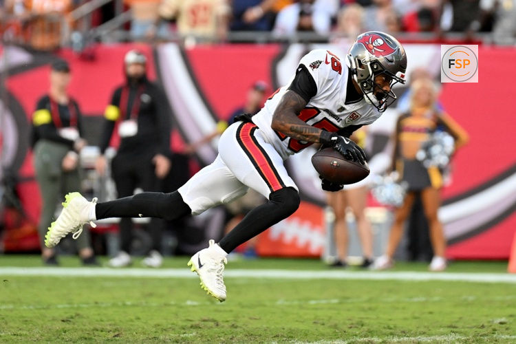 Oct 12, 2025; Tampa, Florida, USA; Tampa Bay Buccaneers wide receiver Tez Johnson (15) runs for a gain during the third quarter against the San Francisco 49ers at Raymond James Stadium. Credit: Jonathan Dyer-Imagn Images