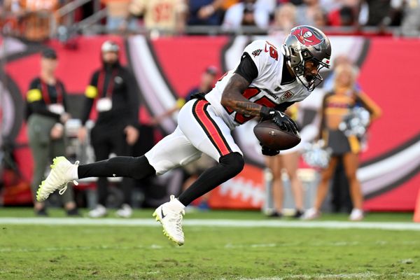 Oct 12, 2025; Tampa, Florida, USA; Tampa Bay Buccaneers wide receiver Tez Johnson (15) runs for a gain during the third quarter against the San Francisco 49ers at Raymond James Stadium. Mandatory Credit: Jonathan Dyer-Imagn Images