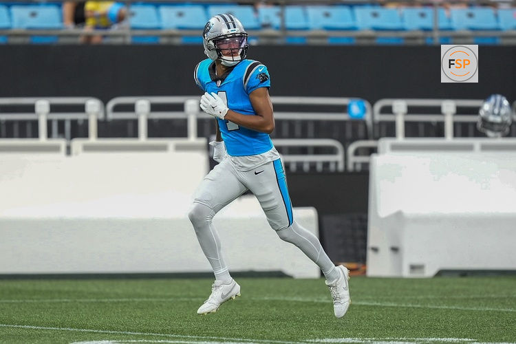 Aug 2, 2025; Charlottle, NC, USA; Carolina Panthers wide receiver Tetairoa McMillan (4) runs a pass route during Fanfest at Bank of America Stadium. Credit: Jim Dedmon-Imagn Images