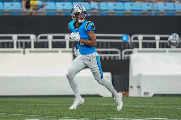 Aug 2, 2025; Charlottle, NC, USA; Carolina Panthers wide receiver Tetairoa McMillan (4) runs a pass route during Fanfest at Bank of America Stadium. Mandatory Credit: Jim Dedmon-Imagn Images