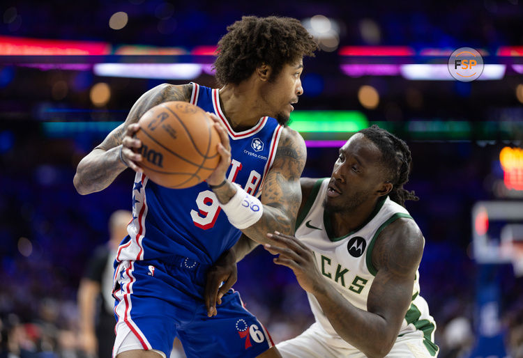 Oct 23, 2024; Philadelphia, Pennsylvania, USA; Philadelphia 76ers guard Kelly Oubre Jr. (9) controls the ball against Milwaukee Bucks forward Taurean Prince (12) during the third quarter at Wells Fargo Center. Credit: Bill Streicher-Imagn Images