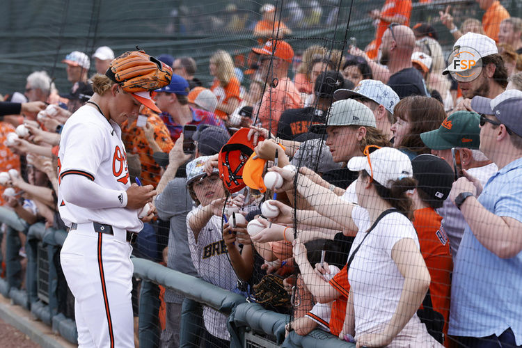 SARASOTA, FL - MARCH 13: Baltimore Orioles second baseman Jackson Holliday (87) signs autographs for fans before an MLB spring training game against the Atlanta Braves on March 13, 2024 at Ed Smith Stadium in Sarasota, Florida. (Photo by Joe Robbins/Icon Sportswire)