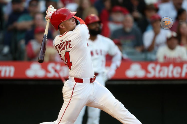 Jun 21, 2025; Anaheim, California, USA;  Los Angeles Angels catcher Logan O'Hoppe (14) hits a home run during the third inning against the Houston Astros at Angel Stadium. Credit: Kiyoshi Mio-Imagn Images