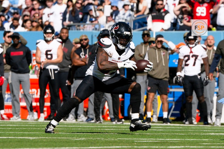 Nov 16, 2025; Nashville, Tennessee, USA;  Houston Texans running back Woody Marks (27) runs with the ball against the Tennessee Titans during the first half at Nissan Stadium. Credit: Steve Roberts-Imagn Images