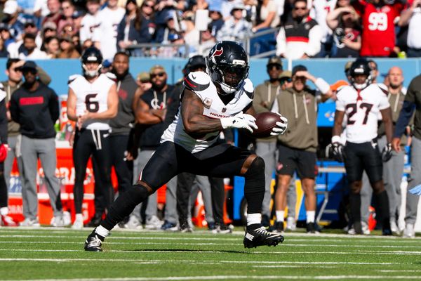 Nov 16, 2025; Nashville, Tennessee, USA;  Houston Texans running back Woody Marks (27) runs with the ball against the Tennessee Titans during the first half at Nissan Stadium. Mandatory Credit: Steve Roberts-Imagn Images