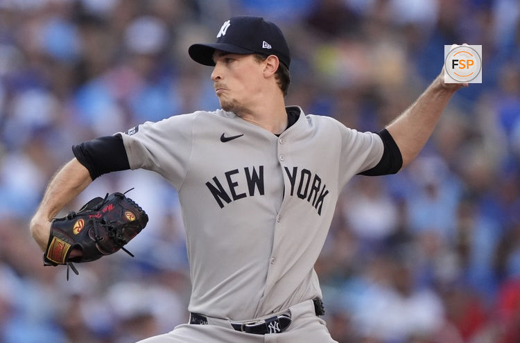 Oct 5, 2025; Toronto, Ontario, CAN; New York Yankees pitcher Max Fried (54) throws in the first inning against the Toronto Blue Jays during game two of the ALDS round for the 2025 MLB playoffs at Rogers Centre. Credit: John E. Sokolowski-Imagn Images