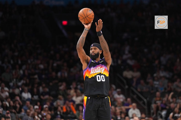 Mar 8, 2026; Phoenix, Arizona, USA; Phoenix Suns forward Royce O'Neale (00) shoots against the Charlotte Hornets during the second half at Mortgage Matchup Center. Credit: Joe Camporeale-Imagn Images
