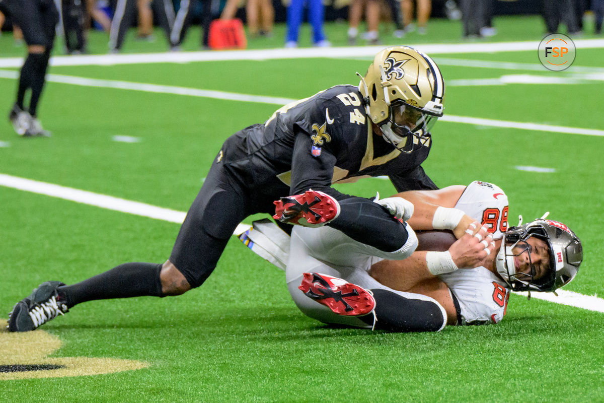 Oct 13, 2024; New Orleans, Louisiana, USA; Tampa Bay Buccaneers tight end Cade Otton (88) scores a touchdown against New Orleans Saints safety Johnathan Abram (24) during the fourth quarter at Caesars Superdome. Credit: Matthew Hinton-Imagn Images