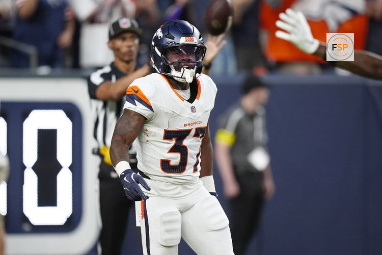 Aug 16, 2025; Denver, Colorado, USA; Denver Broncos running back RJ Harvey (37) celebrates his rushing touchdown in the first quarter against the Arizona Cardinals at Empower Field at Mile High. Credit: Ron Chenoy-Imagn Images