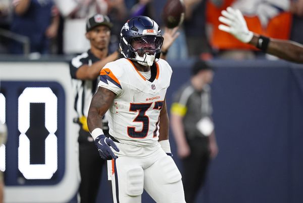 Aug 16, 2025; Denver, Colorado, USA; Denver Broncos running back RJ Harvey (37) celebrates his rushing touchdown in the first quarter against the Arizona Cardinals at Empower Field at Mile High. Mandatory Credit: Ron Chenoy-Imagn Images