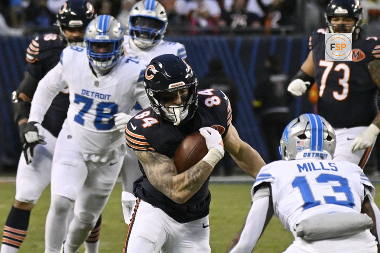 Jan 4, 2026; Chicago, Illinois, USA; Chicago Bears tight end Colston Loveland (84) runs with the ball against Detroit Lions safety Jalen Mills (13) during the first half at Soldier Field. Credit: Matt Marton-Imagn Images