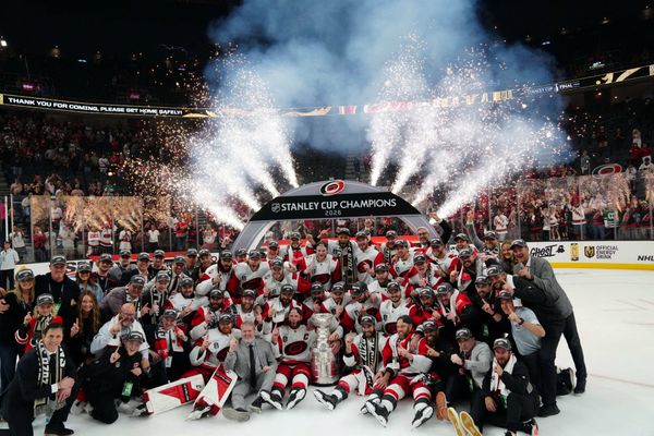 Jun 14, 2026; Las Vegas, Nevada, USA; The Carolina Hurricanes pose with the the Stanley Cup after defeating Vegas Golden Knights in game six of the 2026 Stanley Cup Final at T-Mobile Arena. Mandatory Credit: Stephen R. Sylvanie-Imagn Images     TPX IMAGES OF THE DAY     