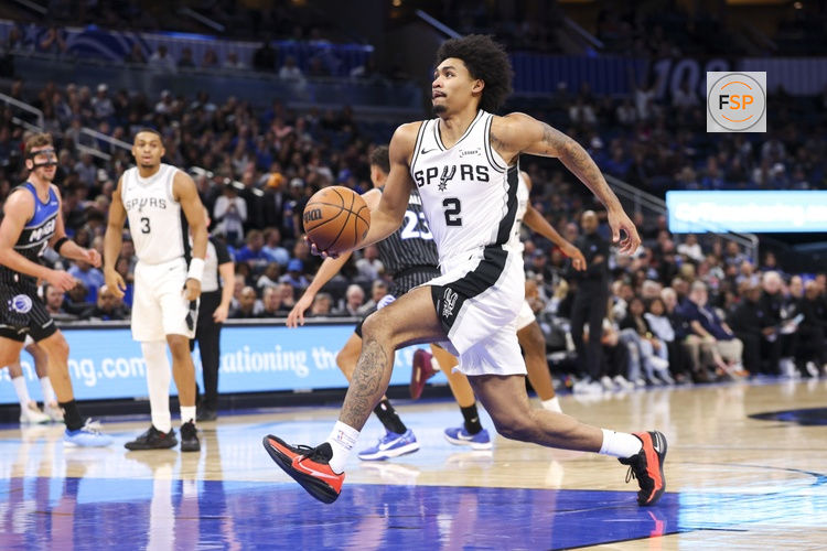 Dec 3, 2025; Orlando, Florida, USA; San Antonio Spurs guard Dylan Harper (2) drives to the basket against the Orlando Magic in the first quarter at Kia Center. Credit: Nathan Ray Seebeck-Imagn Images
