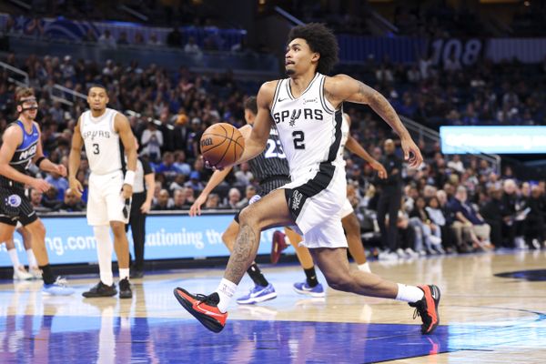 Dec 3, 2025; Orlando, Florida, USA; San Antonio Spurs guard Dylan Harper (2) drives to the basket against the Orlando Magic in the first quarter at Kia Center. Mandatory Credit: Nathan Ray Seebeck-Imagn Images